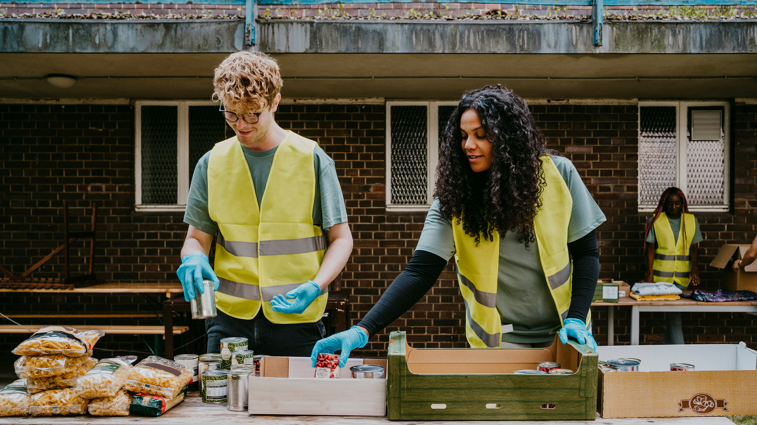 Two people at a food bank